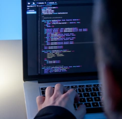 programmer-working-laptop-computer-office-studio 1 (1)